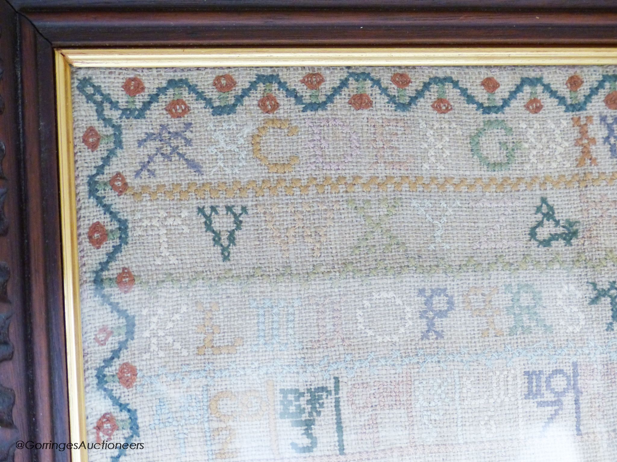 A George IV woolwork embroidered panel, by Ann Griffiths, dated 1818 and a George III needlework sampler dated 1786, 30cm sq.